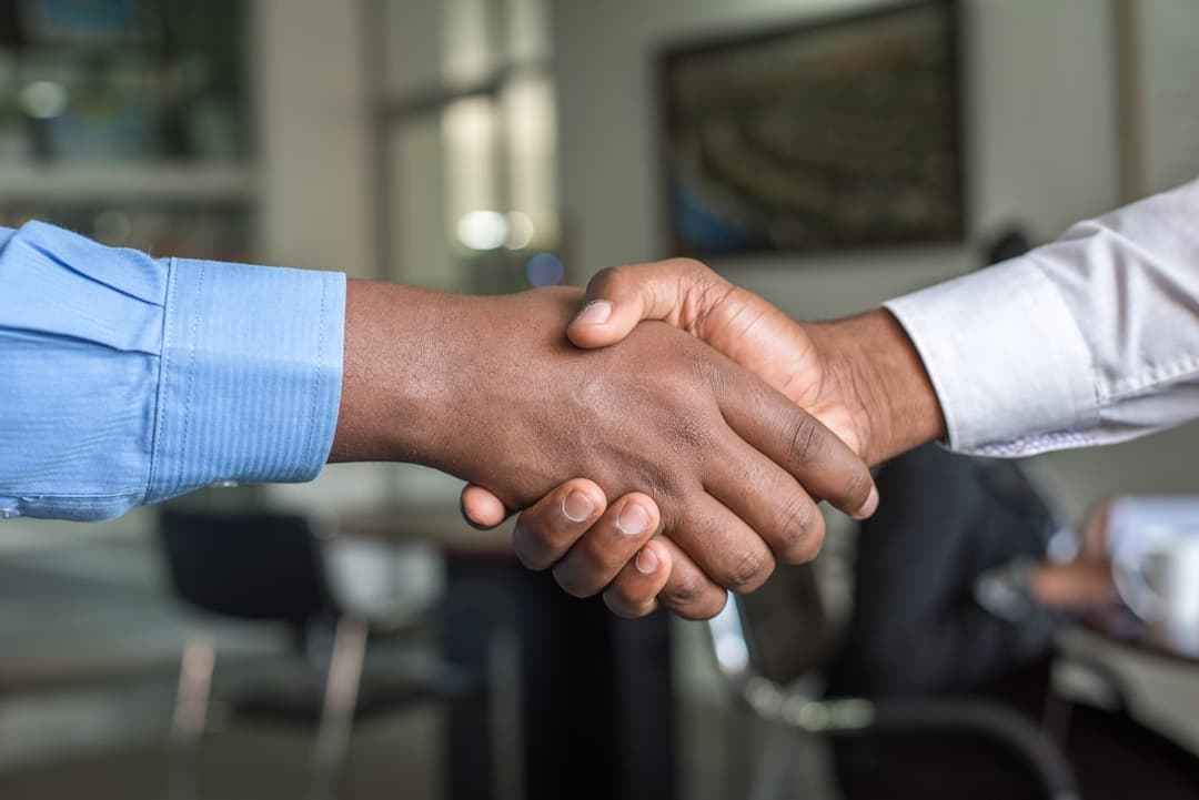 Attorneys meeting with a client in a law office